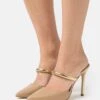 MICHAEL Michael Kors Jessa Mule- Heeled Mules - Camel 1 MICHAEL Michael Kors Jessa Mule- Heeled Mules - Camel -Affordable Shoe Store 33582fa351584198ad3d9235929e11a3