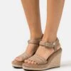 Calvin Klein Wedge- Platform Sandals - Safari 1 Calvin Klein Wedge- Platform Sandals - Safari -Affordable Shoe Store 923d06761bbd4e00b76fe3034d4eff70