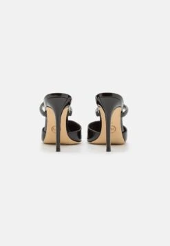 MICHAEL Michael Kors Jessa Mule - Heeled Mules 12 MICHAEL Michael Kors Jessa Mule - Heeled Mules -Affordable Shoe Store c69ac4e50e444a1e8f1995c656dde9a2